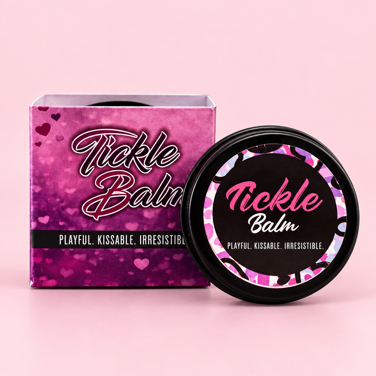 Purple Little Desirez Tickle Balm box beside its round black tin